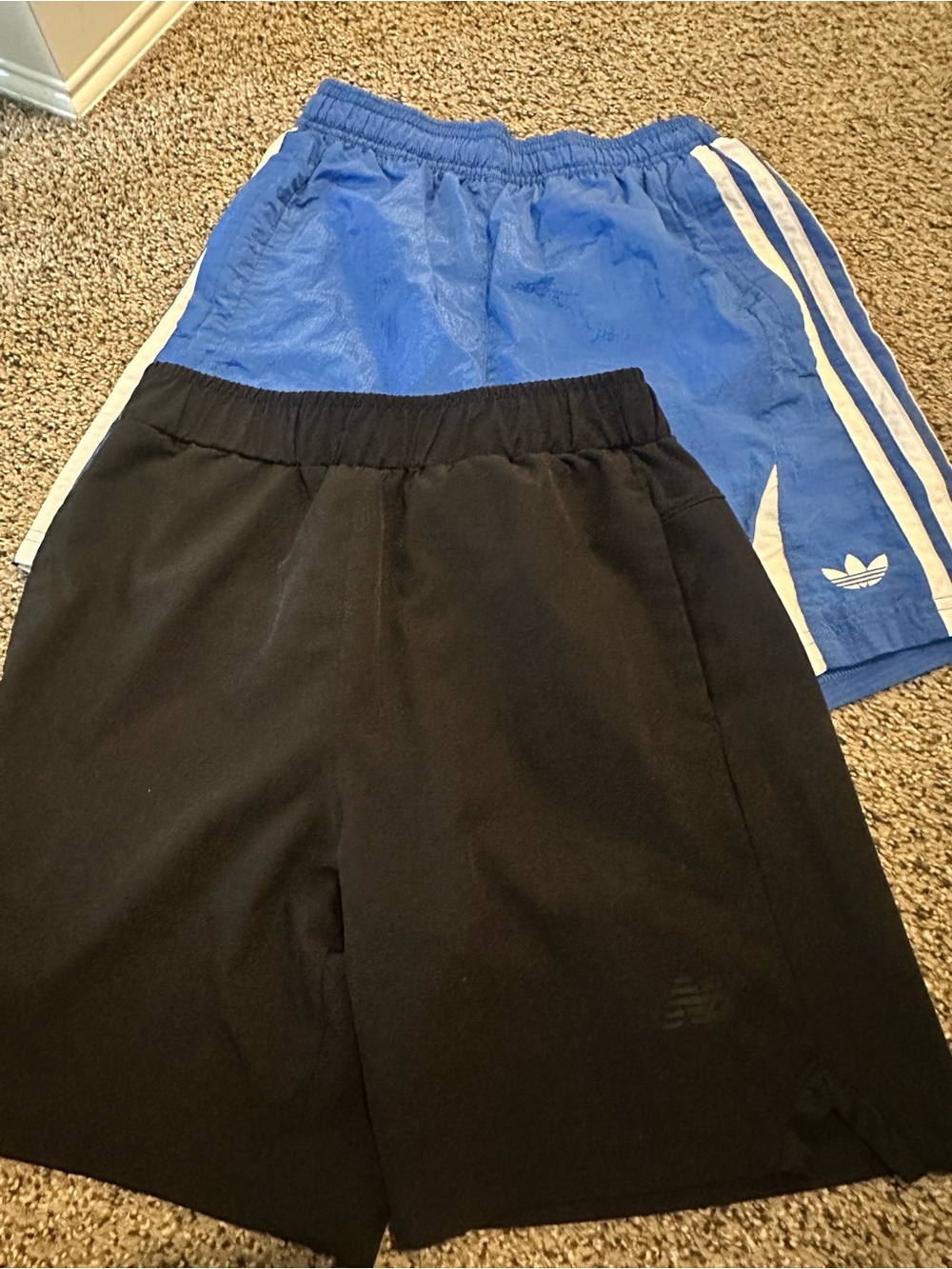 Adidas Youth Blue Athletic Shorts and New Balance black shorts